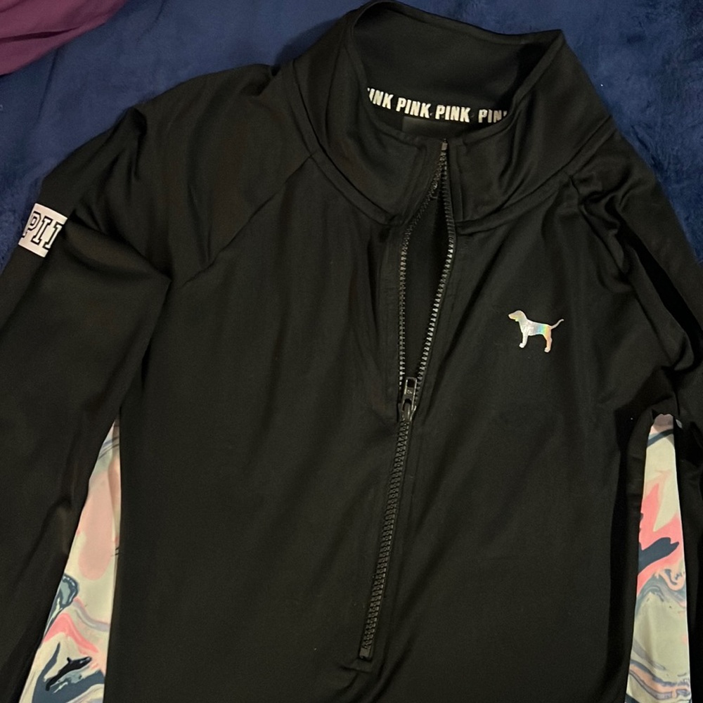 Black top with some color on the side size large,in good use condition